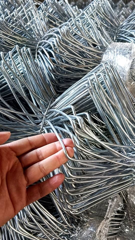 Galvanized chain link fence rolls in warehouse